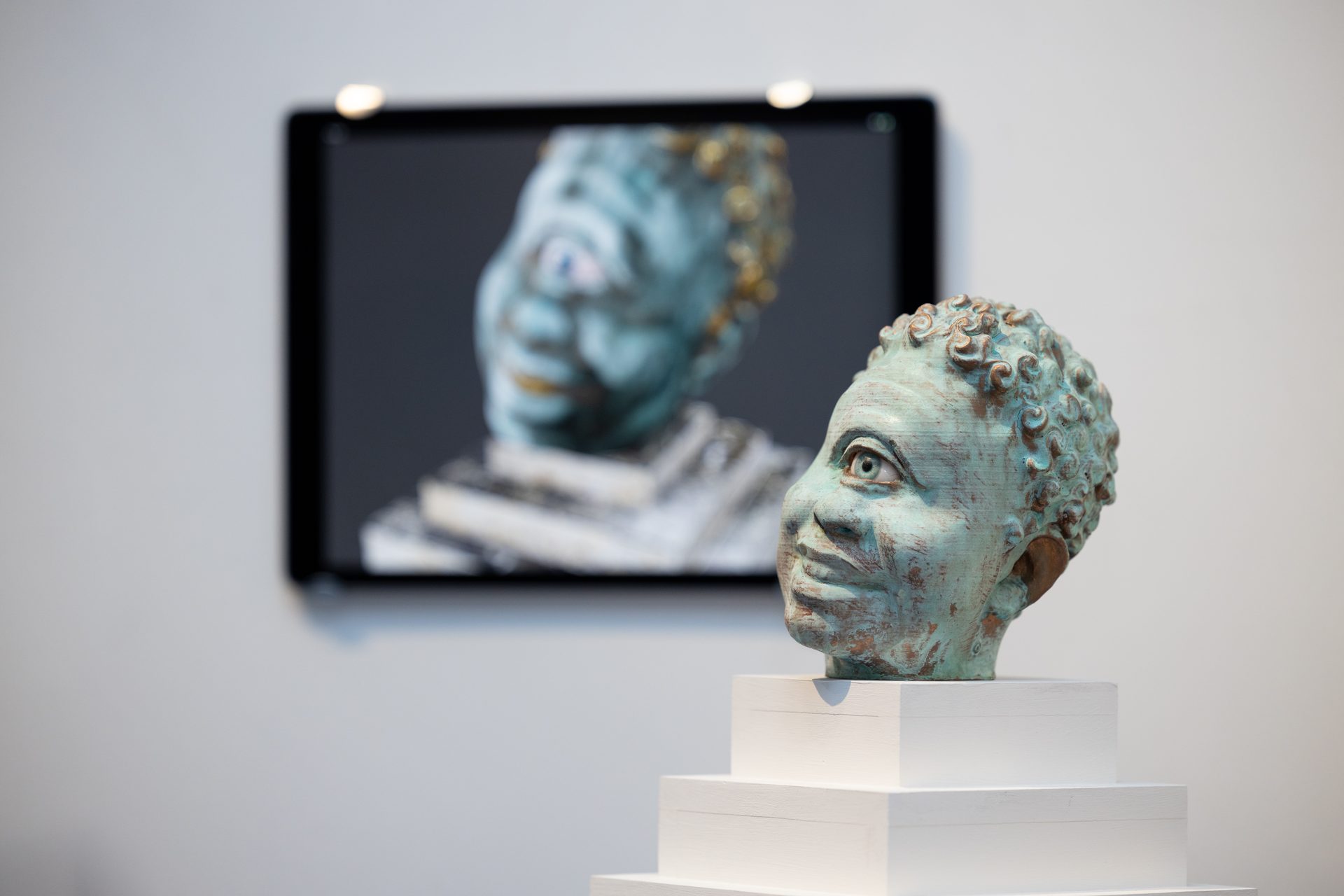 Auriea Harvey — visitor viewing AR sculpture through phone at Art Mûr