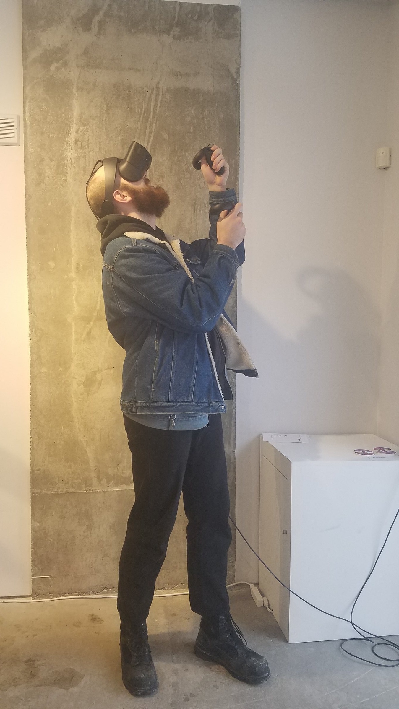 Angeline — visitor inside the fractal cave with headset and controllers at ELLEPHANT Gallery