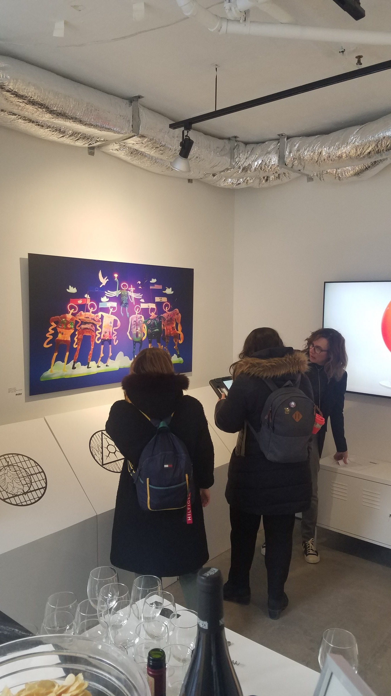 Political Archangels — opening night crowd with the Archangels print and video work at ELLEPHANT Gallery