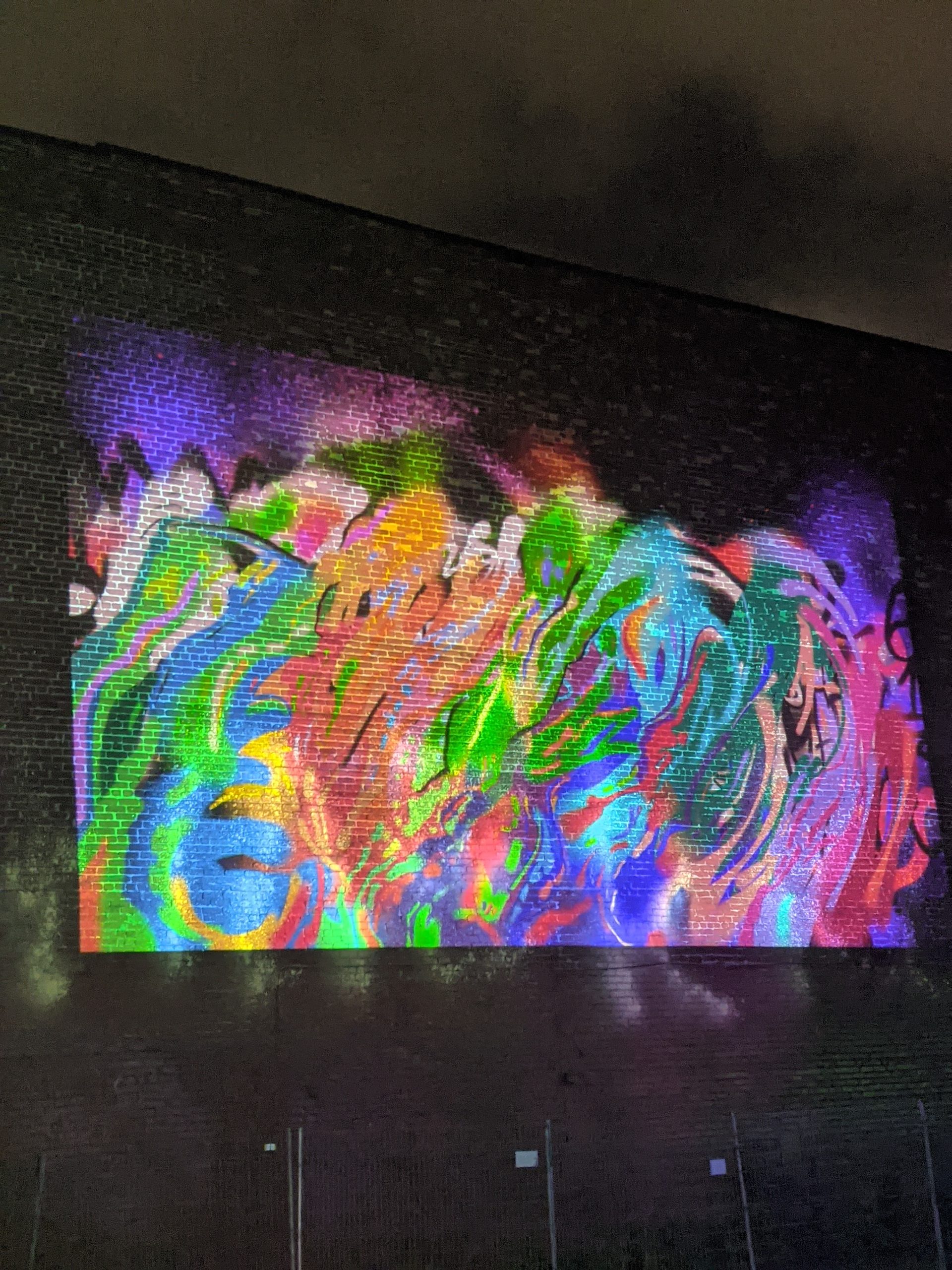 azdead's VR graffiti projected onto building — abstract colorful composition
