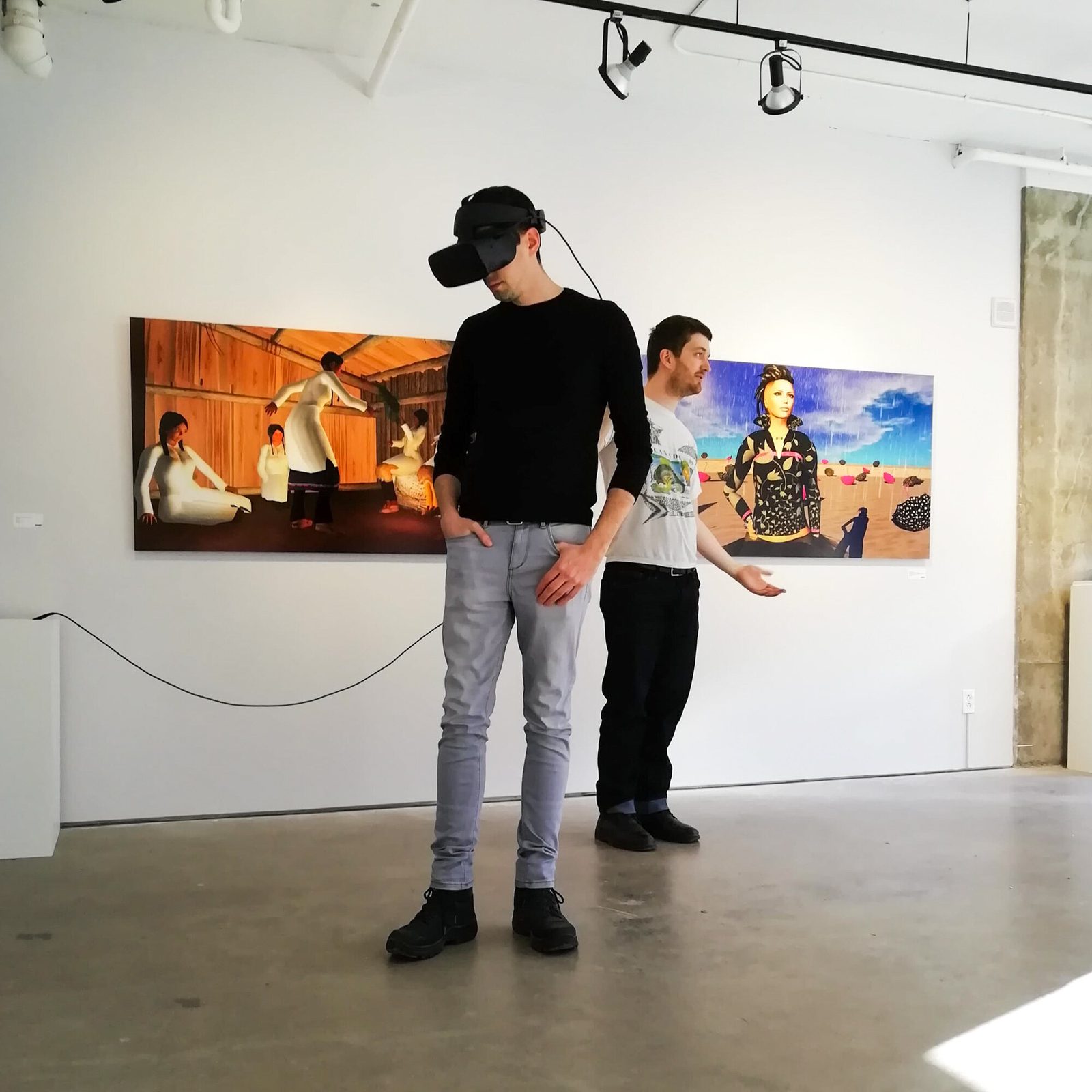 Salvo exhibition — the artist guiding a visitor through the VR experience at Galerie ELLEPHANT